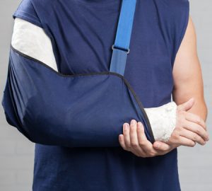 a man with his arm in a splint. 