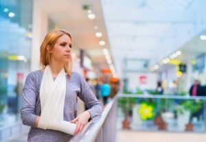 A woman with her arm in a sling