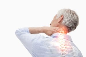 A person reaching to the back of their neck to feel an area experiencing chronic pain.