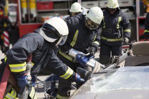 Firefighters responding to a car crash.