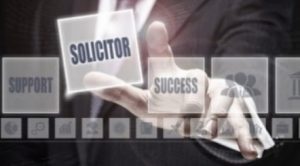 A man in a suit looking at holographic buttons and selecting one labelled 'solicitor'