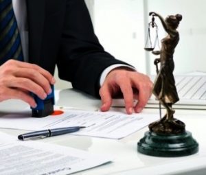 A personal injury solicitor for Glasgow working on a claim at a desk. 