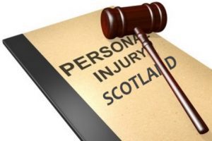 A book and gavel with the words 'Personal Injury Scotland' to represent our guide on the personal injury claims process in Scotland