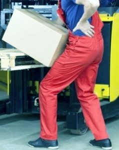 A worker lifting a heavy box