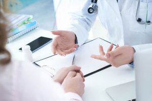 two doctors discussing hospital negligence claims