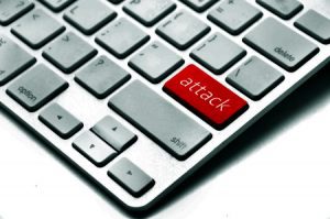 A white keyboard with a single red key reading "attack."