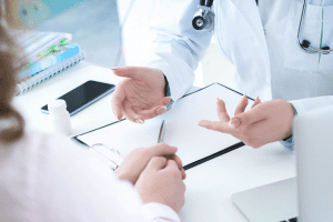 Doctors looking at a medical chart.