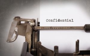 Paper that reads 'confidential' in a type writer