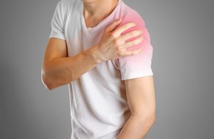 A man with shoulder pain wanting to know about rotator cuff injury at work claims