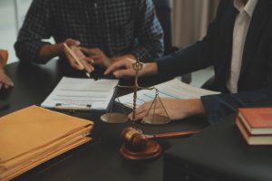 A solicitor and their client discussing car park accident claims in an office