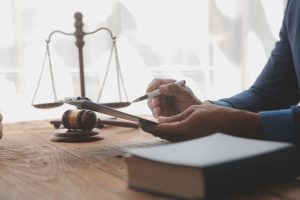 A solicitor sat at their desk calculating compensation for a broken hip