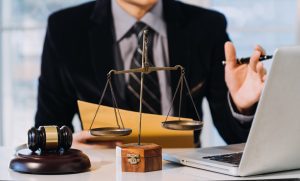 A specialist solicitor sits at their desk while discussing spinal injury claims