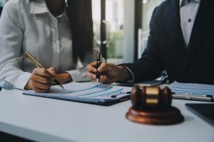 A solicitor explaining to their client how to claim housing disrepair compensation.