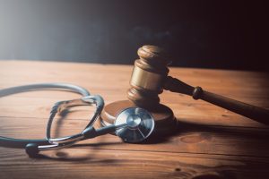 A gavel from Medical negligence experts and a stethoscope 