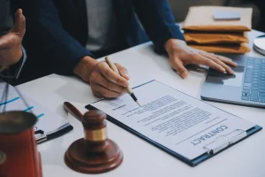 A solicitor helps a client with a claim form and the claims process after an accident 